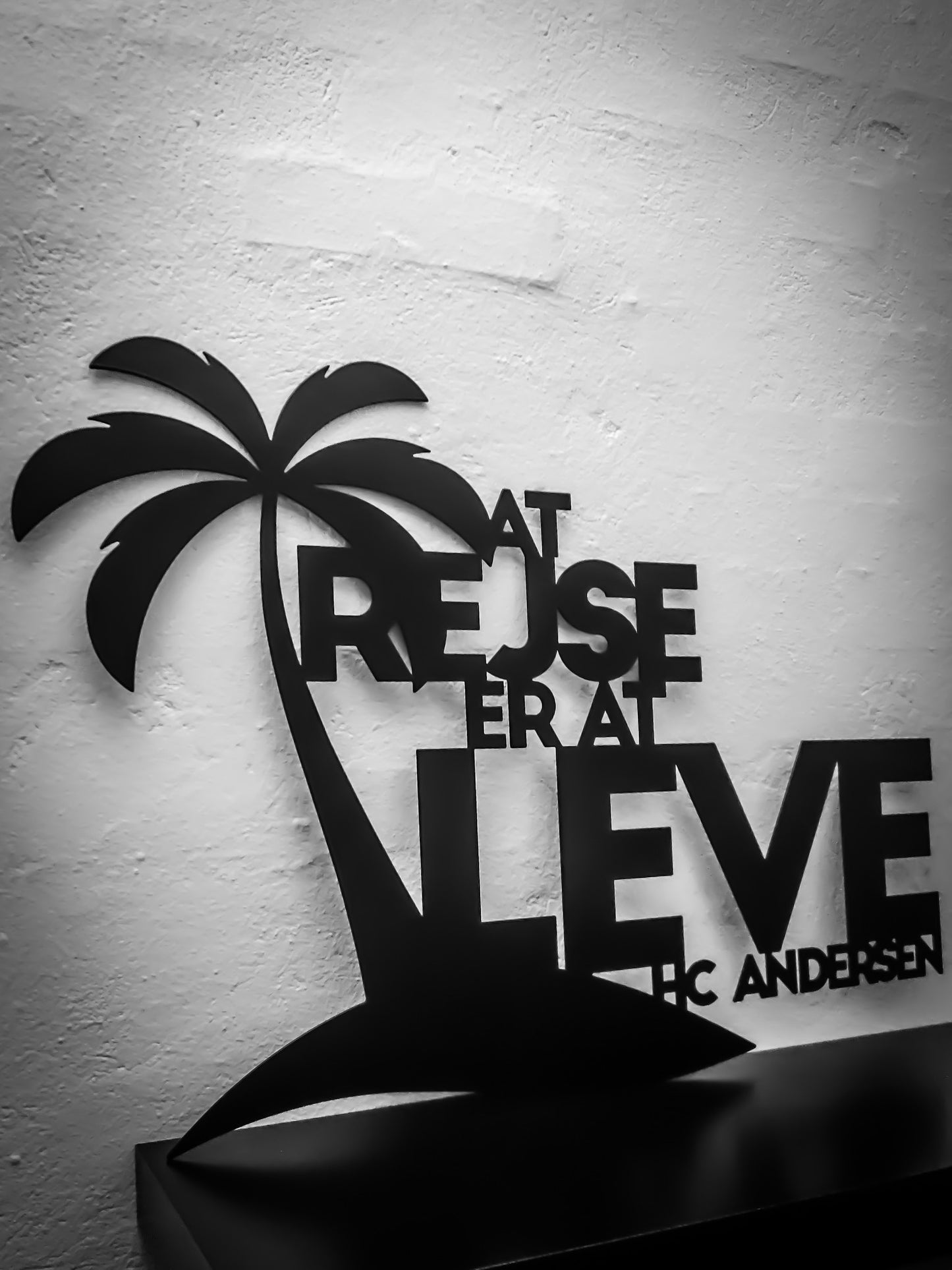 Skilt med tekst - At rejse er at leve